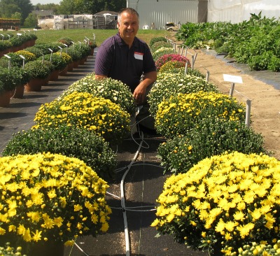 5009_ron_sant_helped_welcome_growers_to_the_annual_george_sant_and_sons_greenhouses_open_house_in_september_2012